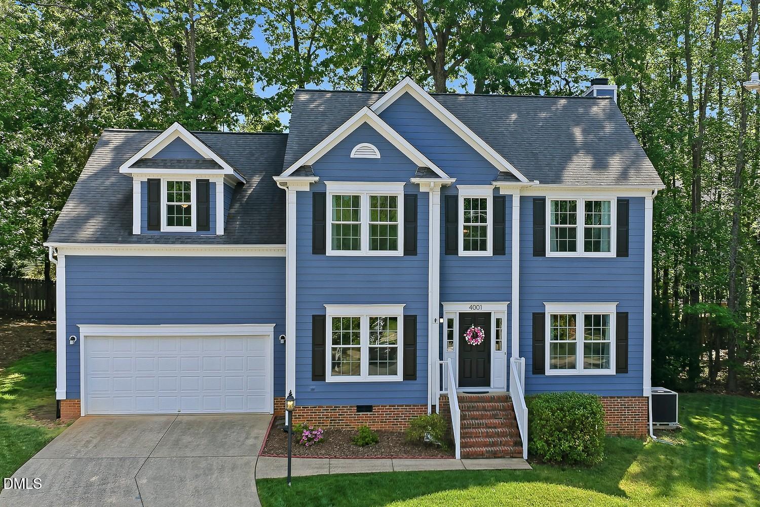 4001 Batiste Road Raleigh, NC 27613 - Photo 53 of 63 a front view of a house with yard and green space