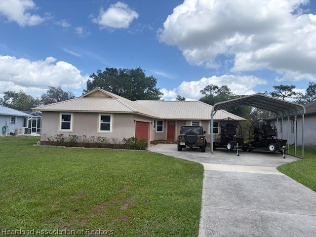 5330 Lakewood Road Sebring, FL 33875 - Photo 1 of 19 a view of a house with a yard