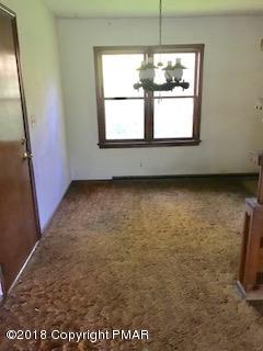 235 Tanite Road Stroudsburg, PA 18360 - Photo 5 of 13 a view of a livingroom with an empty space and a window