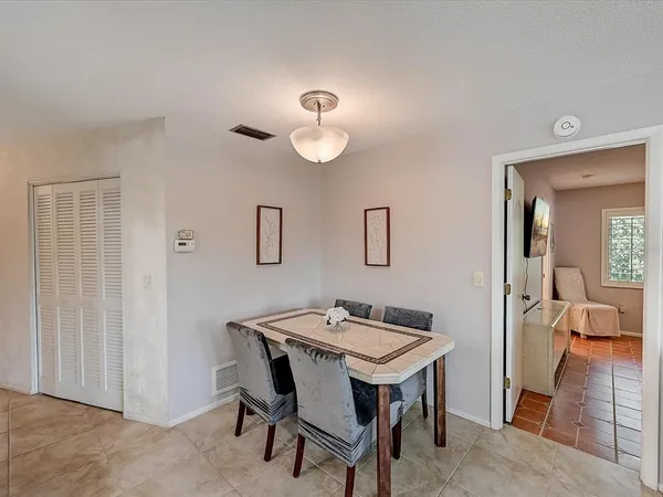 a bedroom with a bed and a ceiling fan
