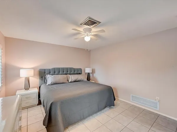 a view of a lake with houses in the back