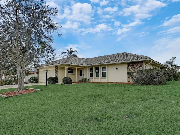 an aerial view of a house with a garden