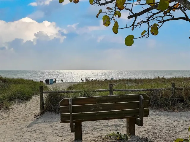 a view of a street with cars on the road