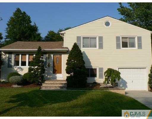 17 Finley Road Edison, NJ 08817 - Photo 1 of 10 a front view of a house with a garden