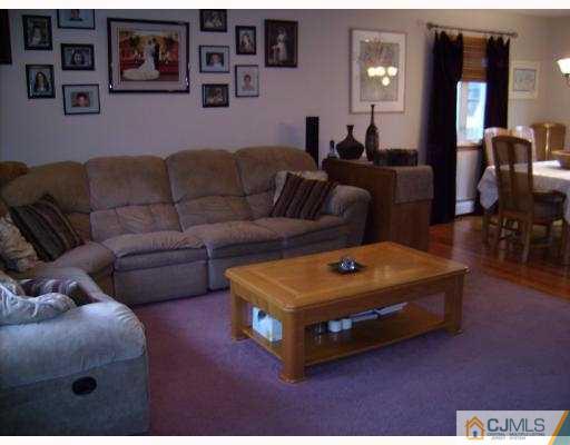 17 Finley Road Edison, NJ 08817 - Photo 2 of 10 a living room with furniture and wooden floor