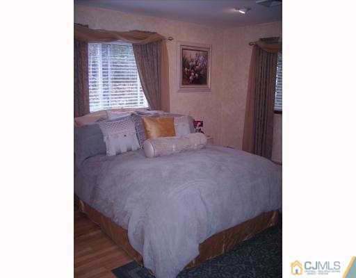 17 Finley Road Edison, NJ 08817 - Photo 5 of 10 a bedroom with a bed and a window