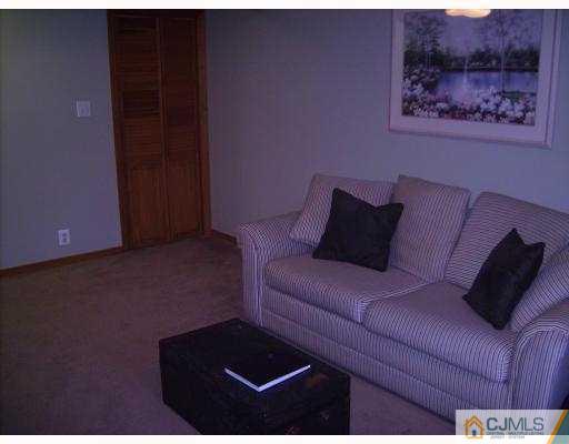 17 Finley Road Edison, NJ 08817 - Photo 9 of 10 a living room with furniture and a air conditioner vent