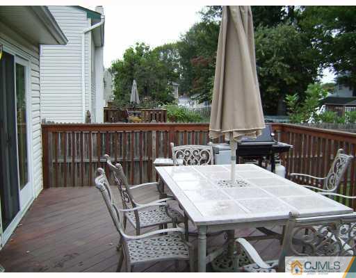 17 Finley Road Edison, NJ 08817 - Photo 10 of 10 a view of a dinning table and chairs in the patio