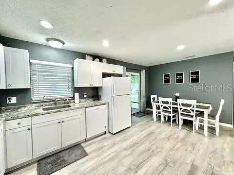 a bedroom with a bed and flat screen tv