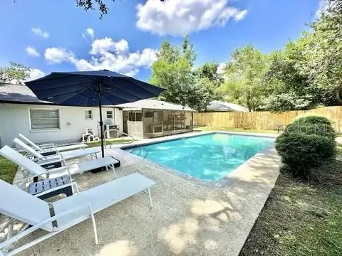a view of a house with a yard porch and sitting area
