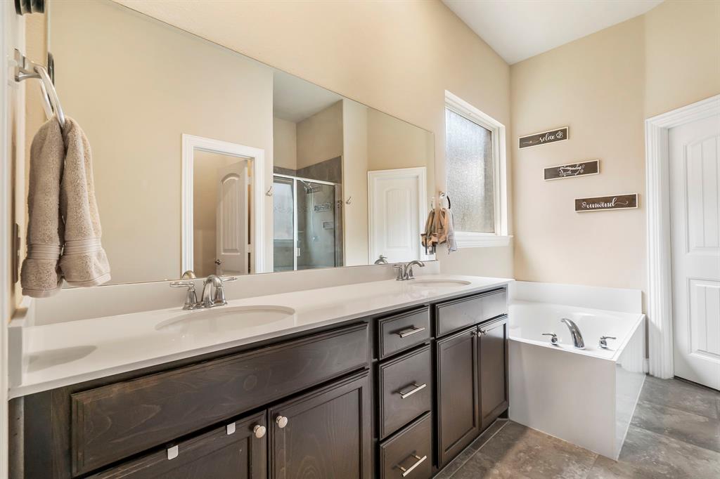 3610 Bastrop Street Melissa, TX 75454 - Photo 16 of 23 a bathroom with a sink double vanity granite tub shower and a mirror