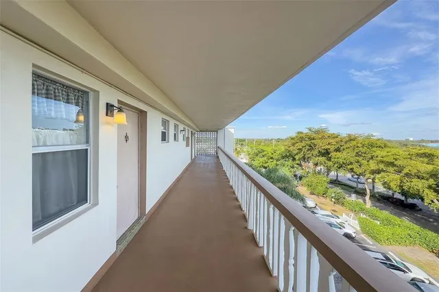 a view of entryway with stairs and wooden floor