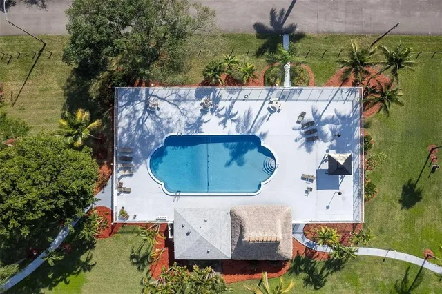 an aerial view of a residential apartment building with outdoor space