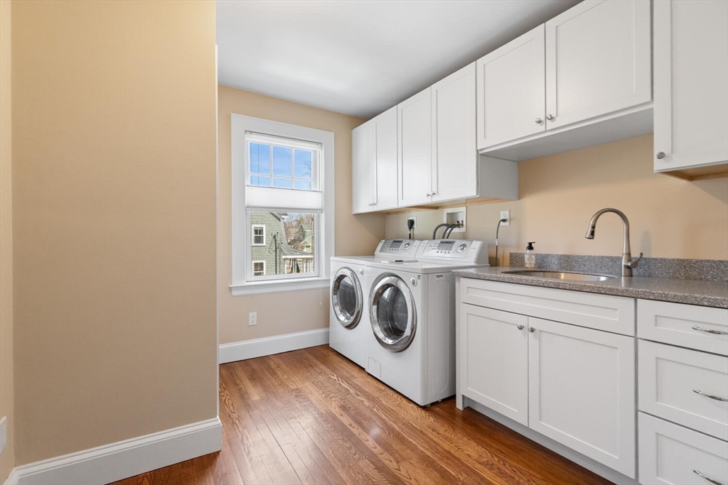 209 Waltham Street Lexington, MA 02421 - Photo 25 of 39 a utility room with sink dryer and washer