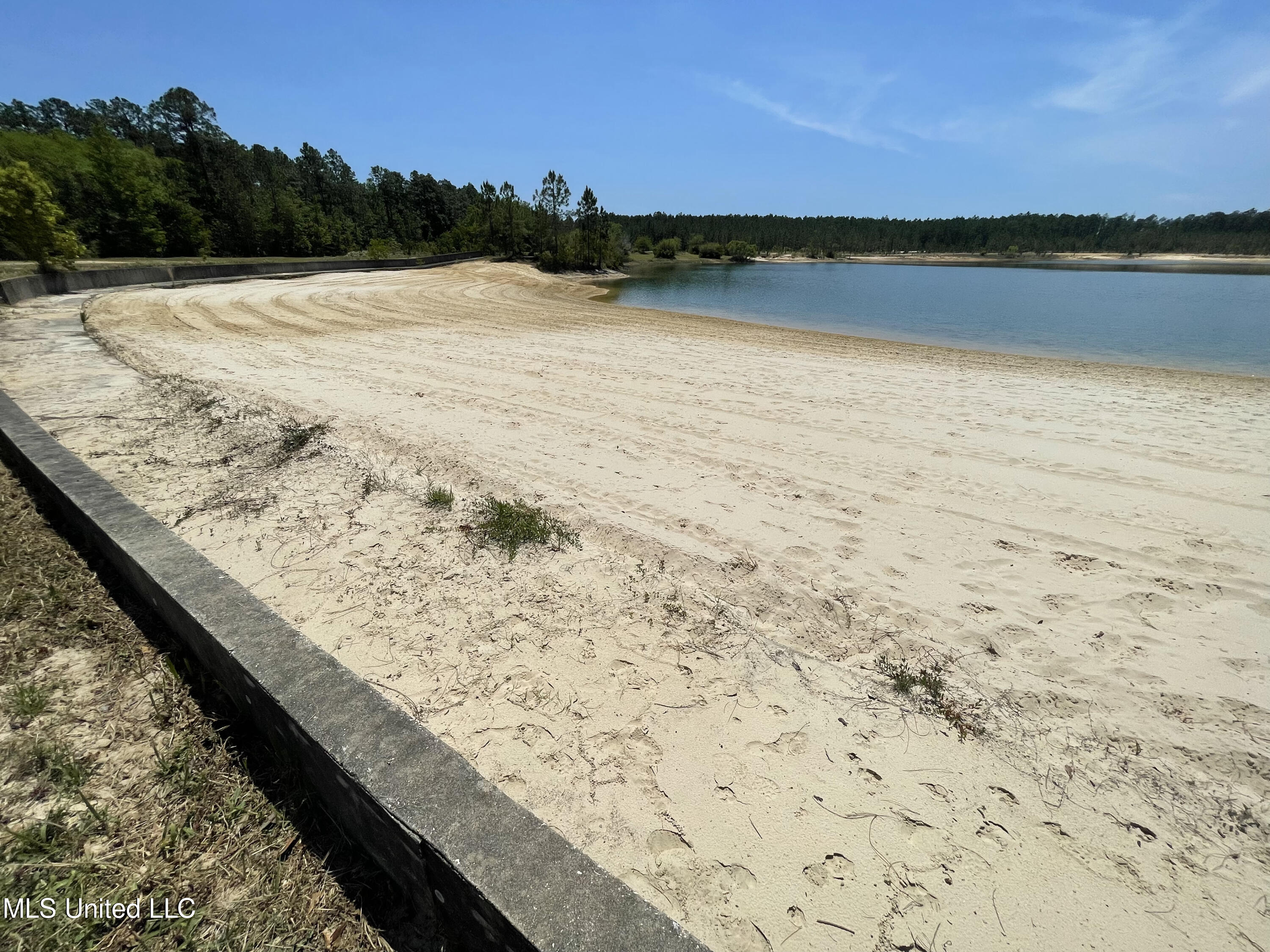 11290 Lily Orchard Road Moss Point, MS 39562 - Photo 4 of 18 Private beach with retaining wall