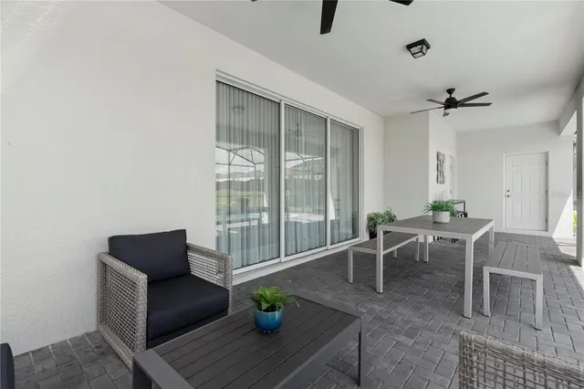 a bedroom with a bed and painting on the wall