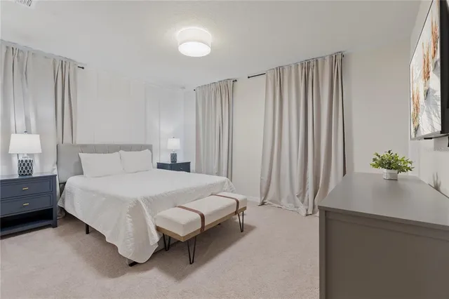 a bedroom with a bed and furniture