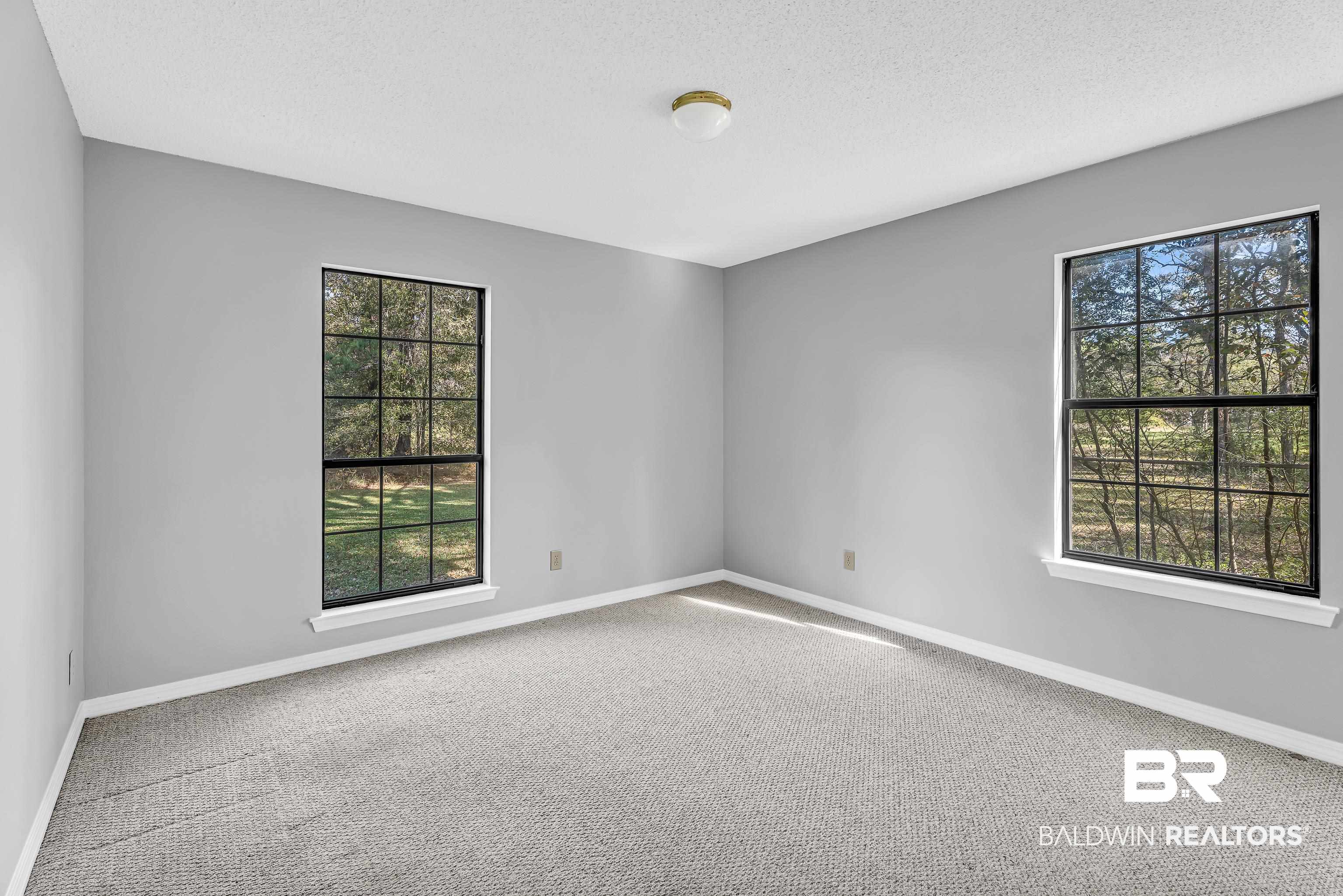 7787 Bellingrath Road Theodore, AL 36582 - Photo 21 of 36 Unfurnished room featuring carpet flooring and a textured ceiling