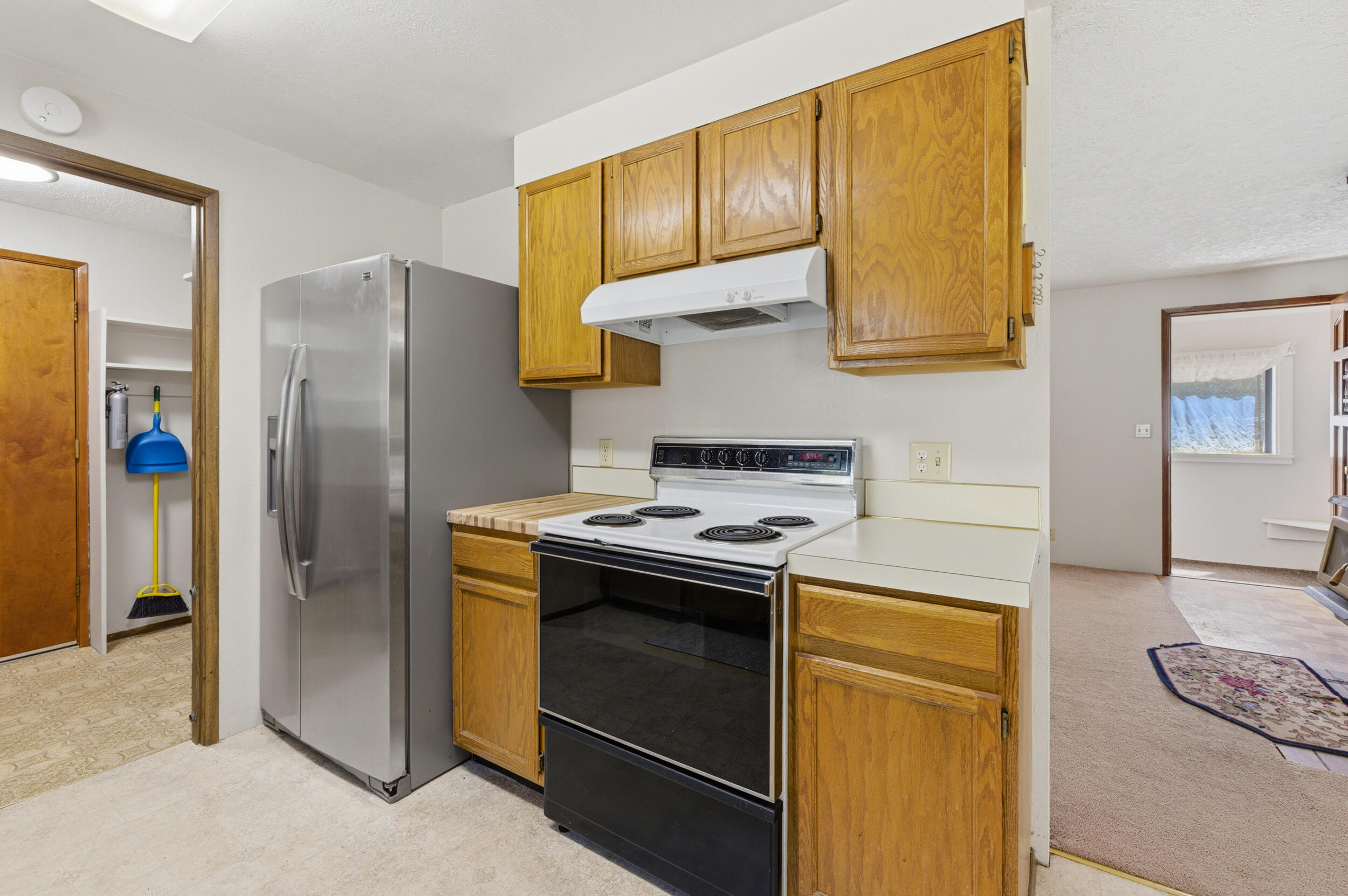50868 Doe Loop La Pine, OR 97739 - Photo 15 of 51 a kitchen with stainless steel appliances granite countertop a stove a refrigerator and a cabinets