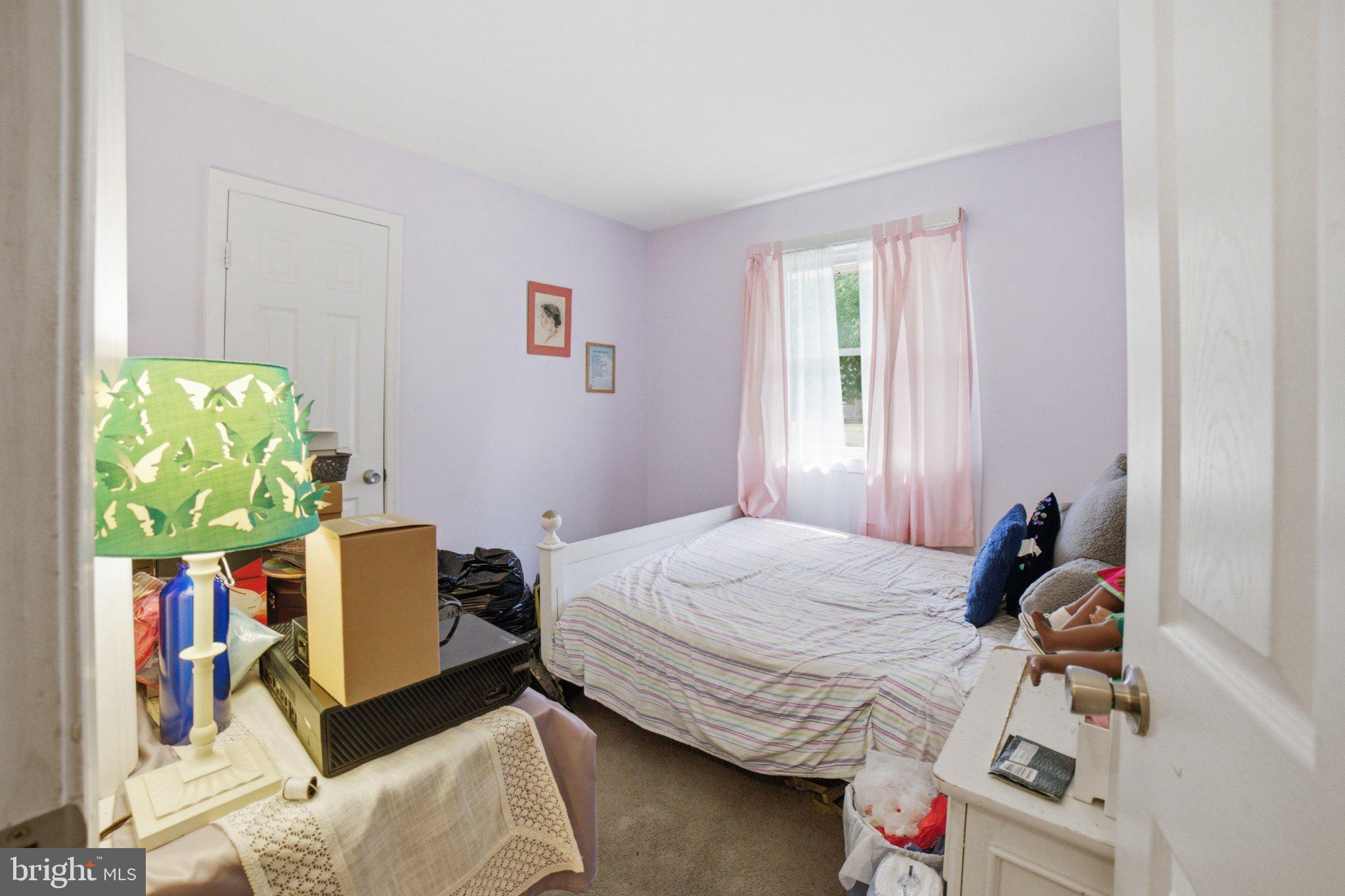 907 Logwood Road Capitol Heights, MD 20743 - Photo 8 of 16 Cozy bedroom with soft pastel hues.