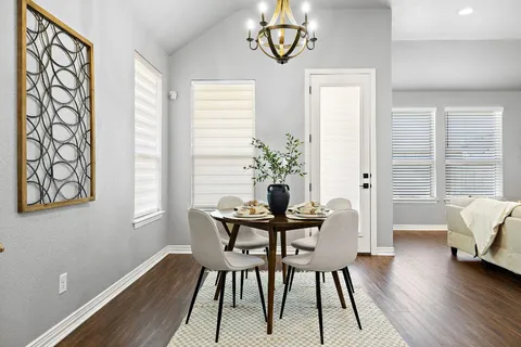 a view of a dining room with furniture window and wooden floor