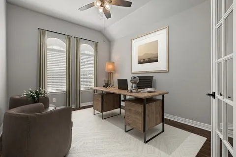 a work room with furniture and window