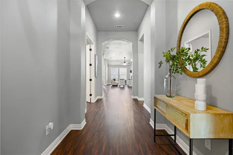 wooden floor in an entryway with a workspace
