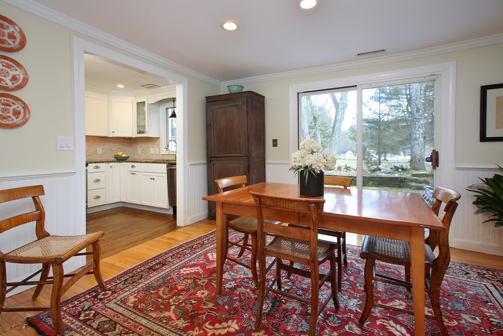 82 Jericho Road, Unit 82 Weston, MA 02493 - Photo 3 of 9 a view of a dining room with furniture window and wooden floor