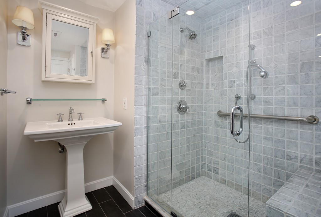 82 Jericho Road, Unit 82 Weston, MA 02493 - Photo 4 of 9 a bathroom with a sink mirror and shower