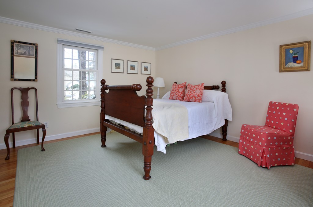 82 Jericho Road, Unit 82 Weston, MA 02493 - Photo 7 of 9 a bed room with a bed chair and a window