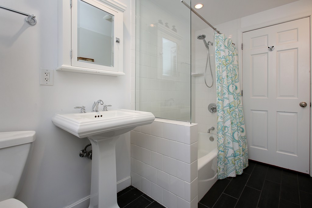 82 Jericho Road, Unit 82 Weston, MA 02493 - Photo 8 of 9 a bathroom with a sink a toilet and shower