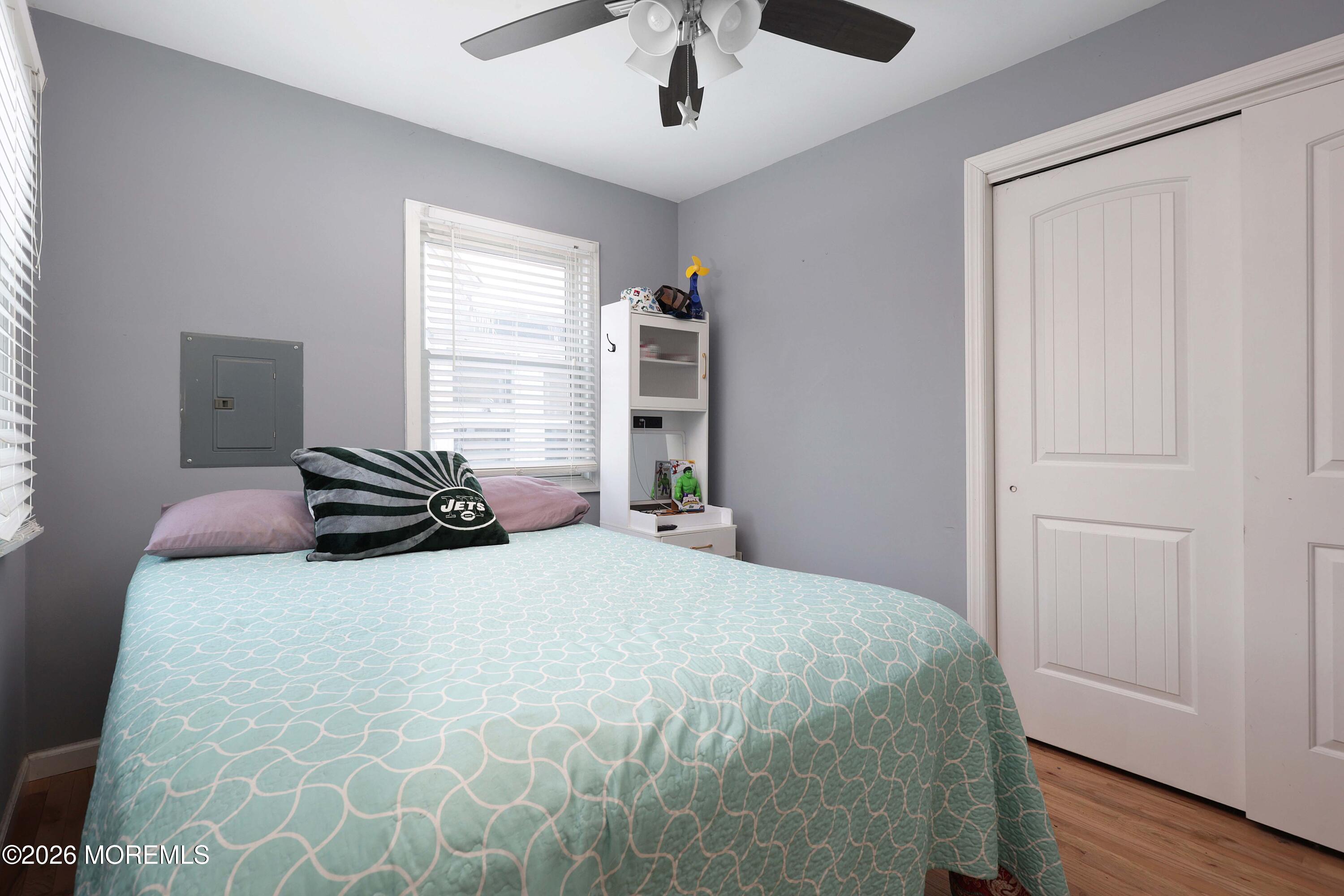 24 West Point Pleasant Avenue Ocean Gate, NJ 08740 - Photo 14 of 23 a bedroom with a bed and a window