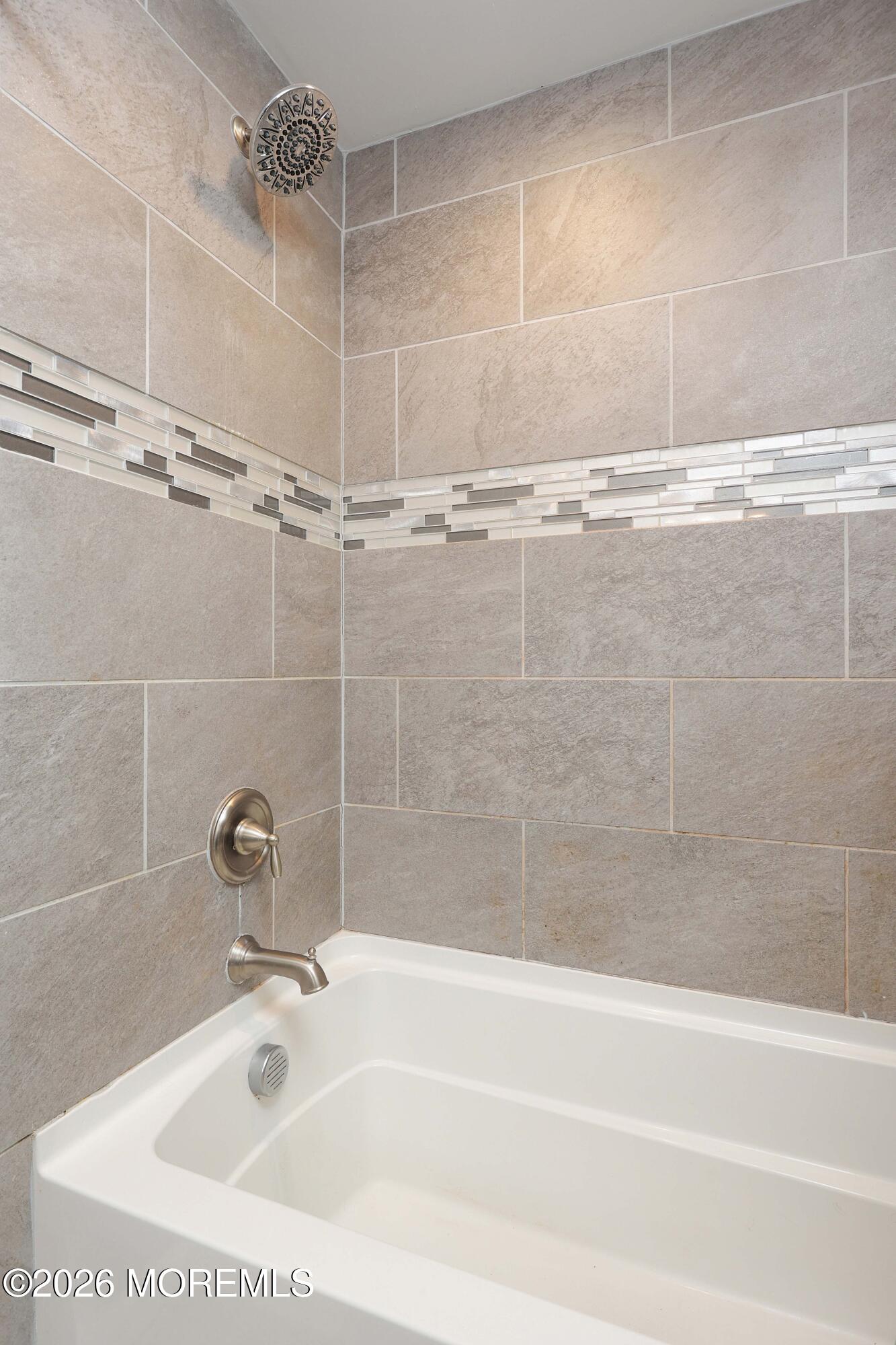 24 West Point Pleasant Avenue Ocean Gate, NJ 08740 - Photo 18 of 23 a close up of a bathtub in a bathroom