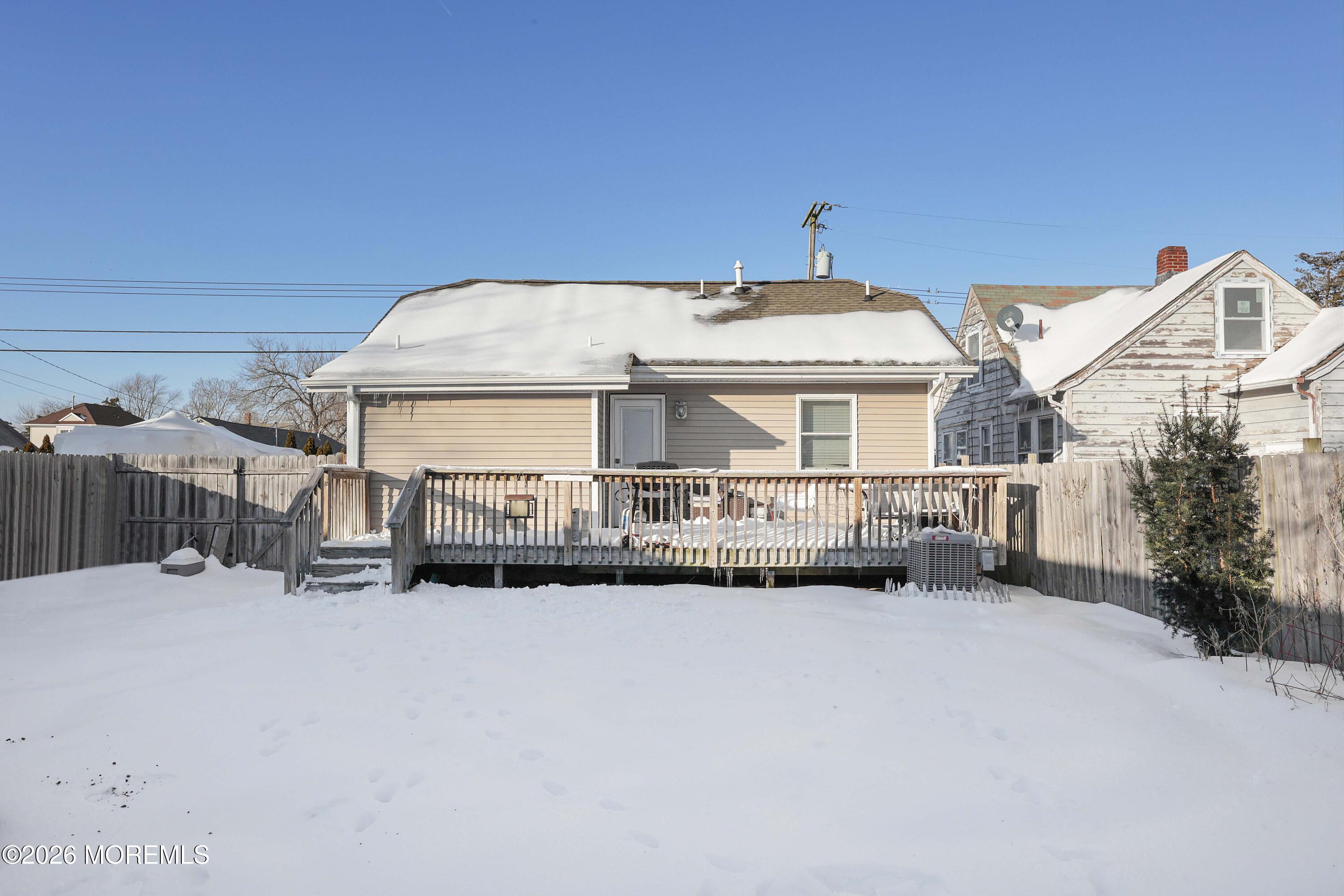 24 West Point Pleasant Avenue Ocean Gate, NJ 08740 - Photo 20 of 23 a front view of a house with a yard and garage