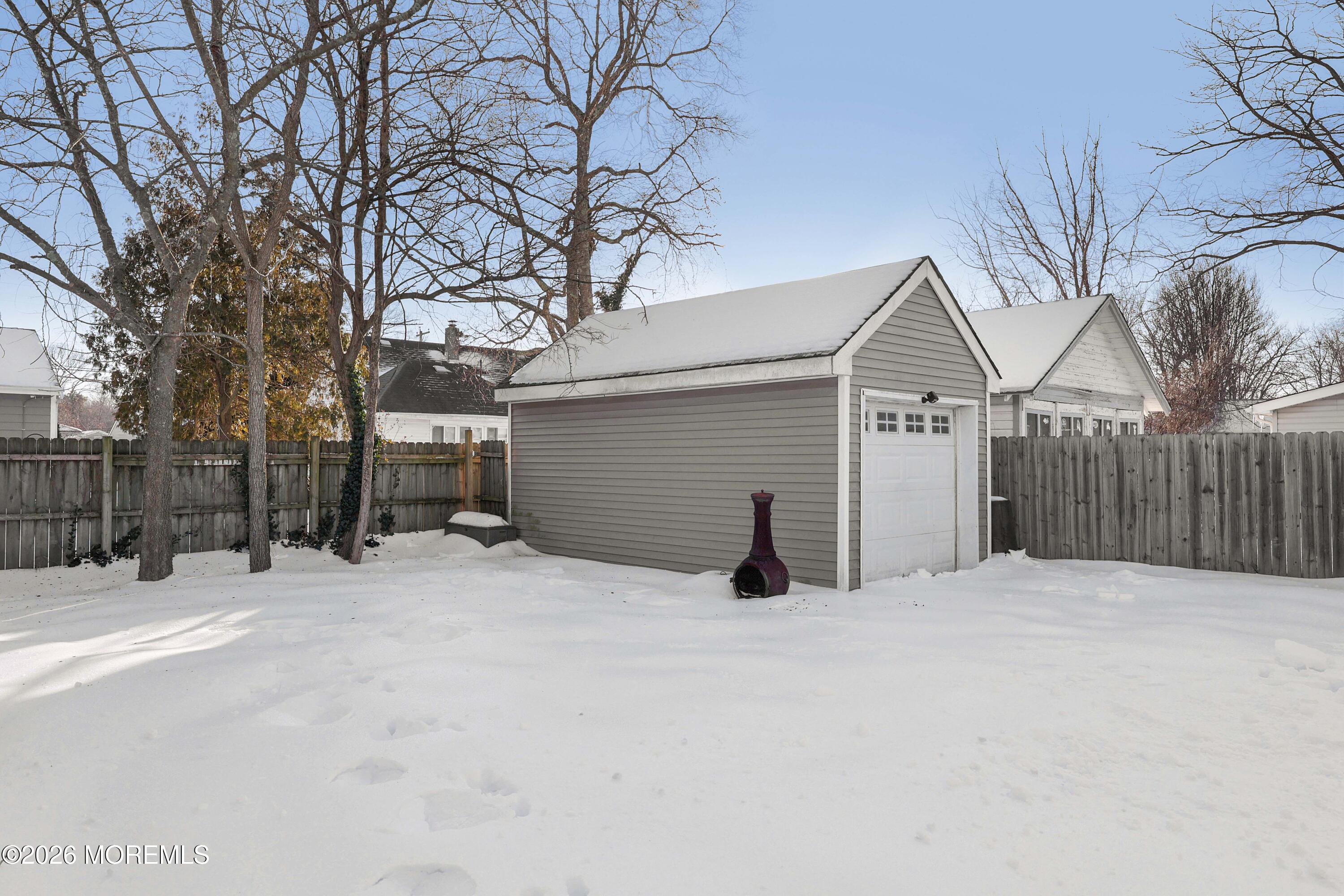 24 West Point Pleasant Avenue Ocean Gate, NJ 08740 - Photo 22 of 23 a view of a house with a snow in forest