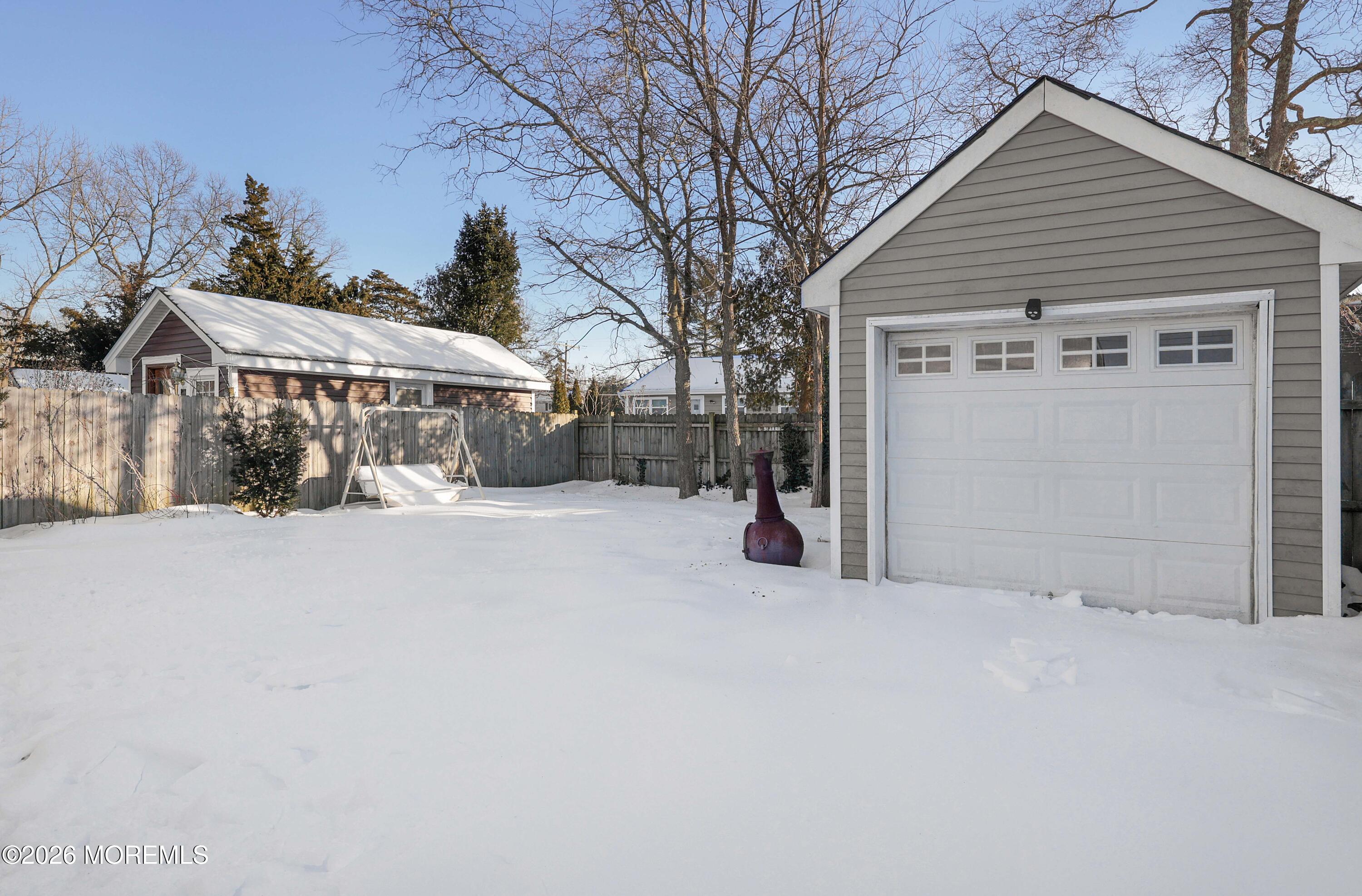 24 West Point Pleasant Avenue Ocean Gate, NJ 08740 - Photo 23 of 23 a view of a house with a yard and garage