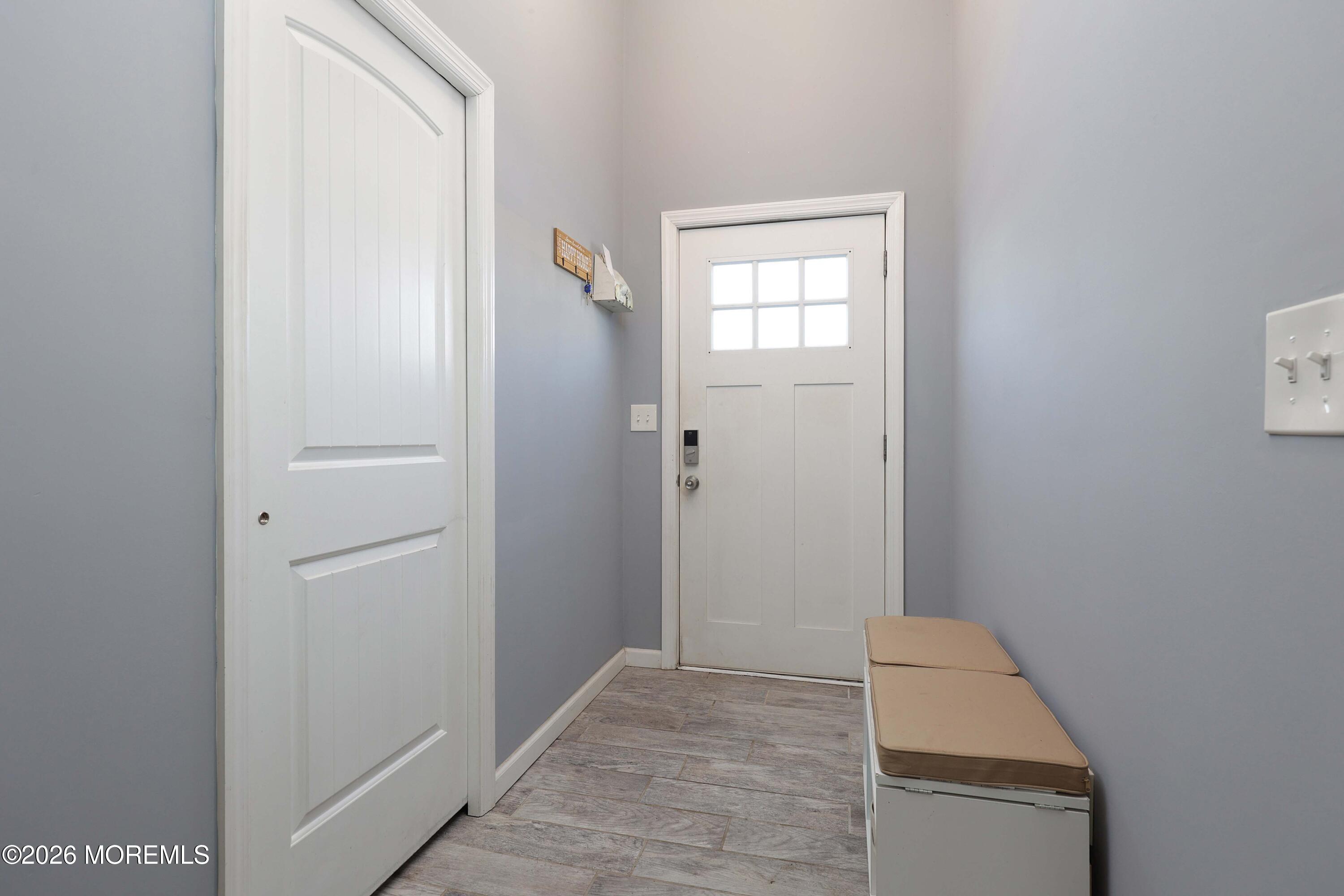 24 West Point Pleasant Avenue Ocean Gate, NJ 08740 - Photo 6 of 23 a view of a room that has a window in it