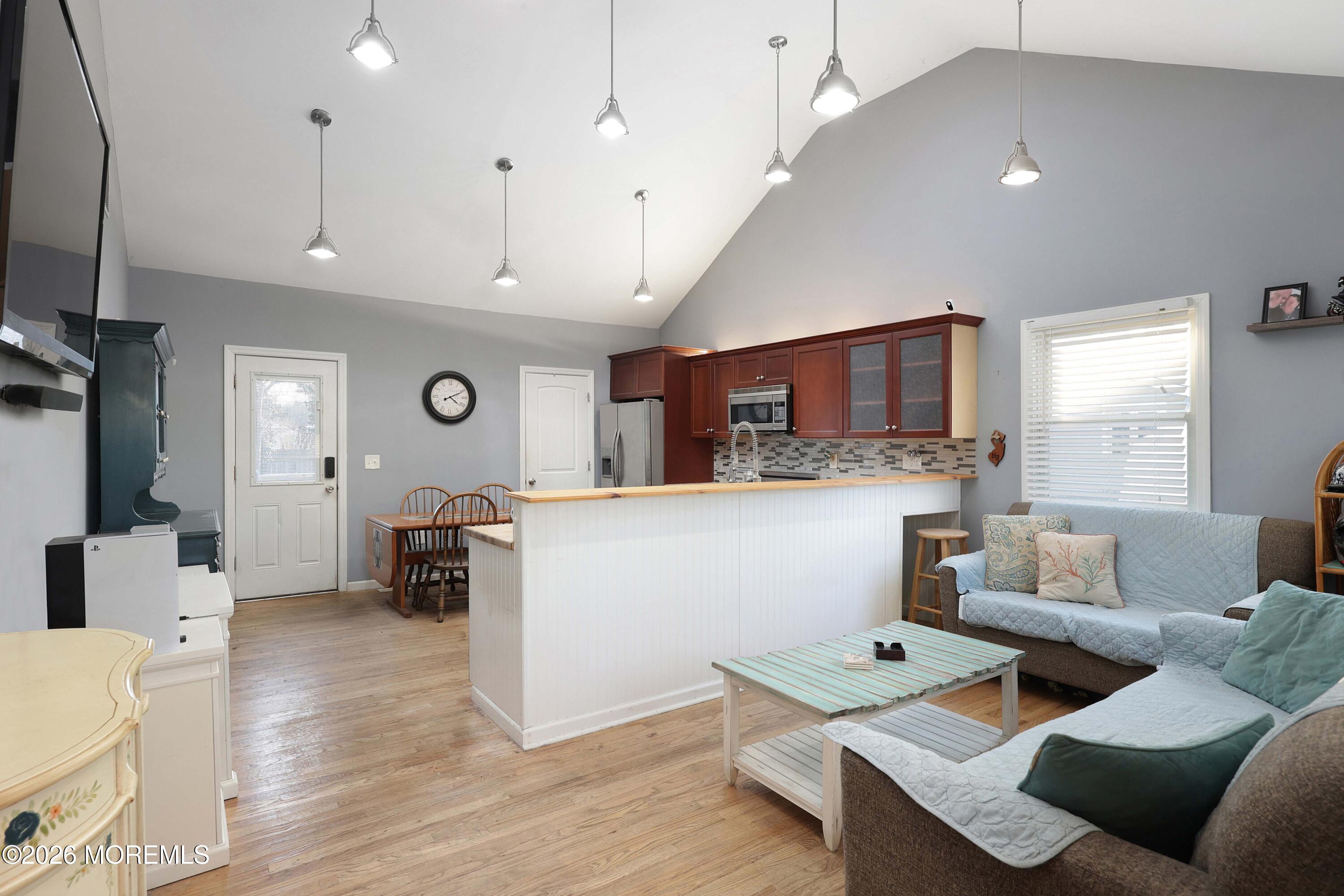 24 West Point Pleasant Avenue Ocean Gate, NJ 08740 - Photo 7 of 23 a living room with furniture and kitchen view