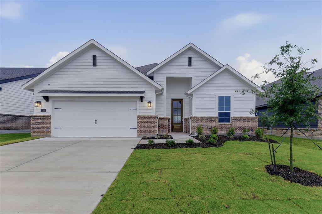 1329 Frio Drive Springtown, TX 76082 - Photo 3 of 25 Contemporary facade featuring white horizontal siding and a brick-finish wainscot