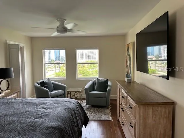 a bedroom with furniture and a window