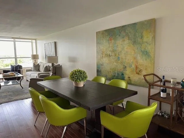 a view of a dining room with furniture and wooden floor
