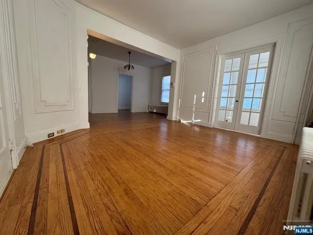 wooden floor in a hall with an entryway