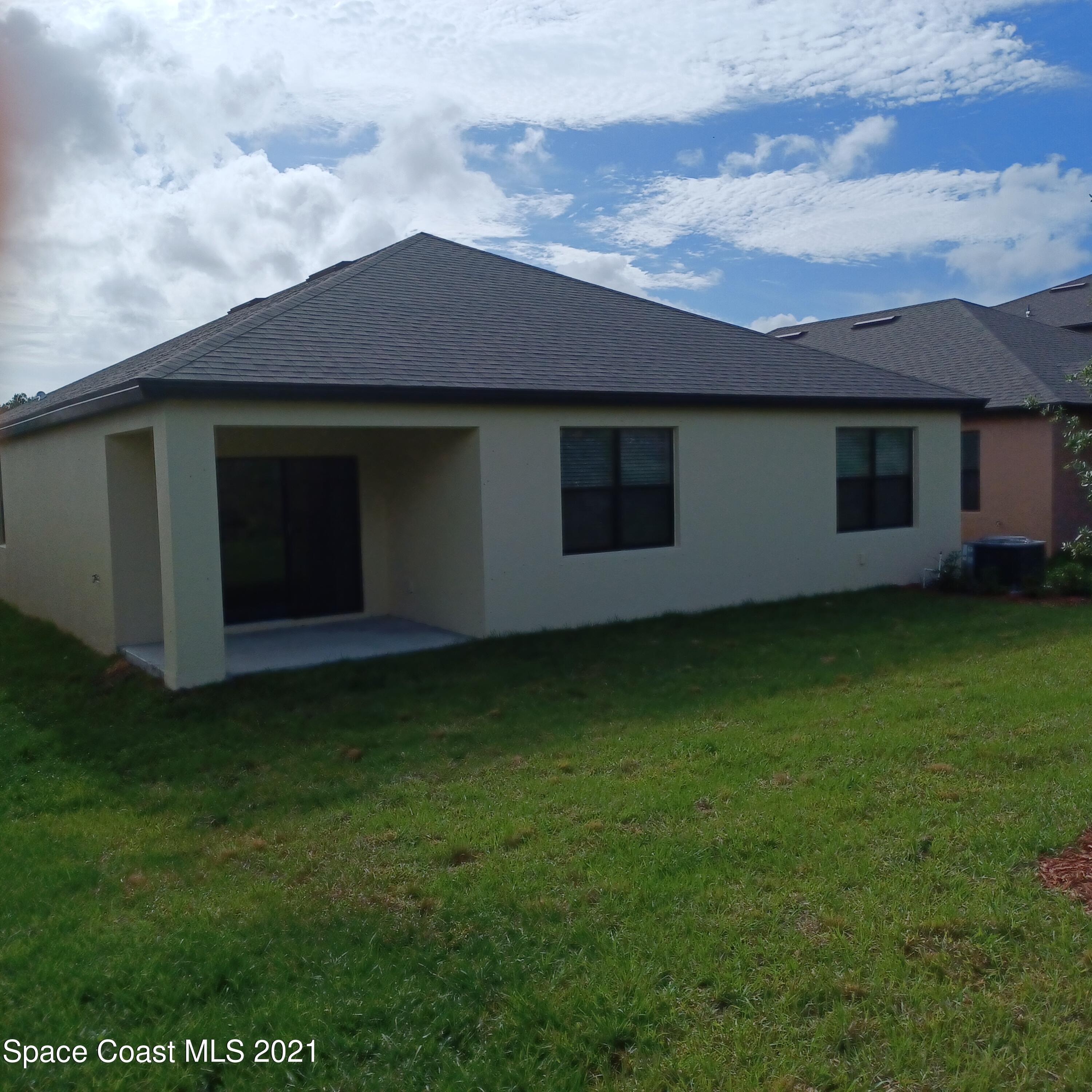 6558 Marble Road Cocoa, FL 32927 - Photo 12 of 16 a house with a yard