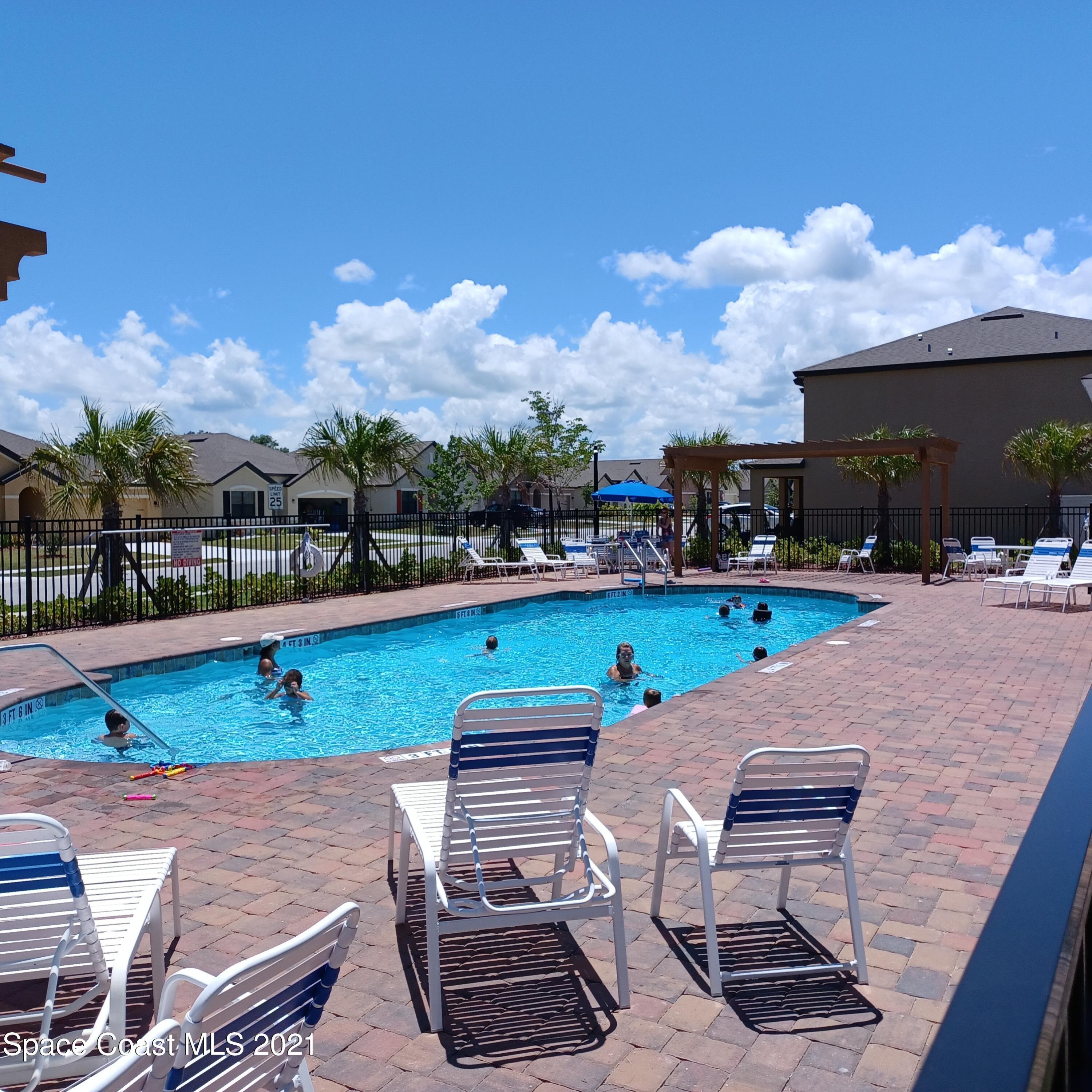 6558 Marble Road Cocoa, FL 32927 - Photo 13 of 16 a view of a patio with a table and chairs