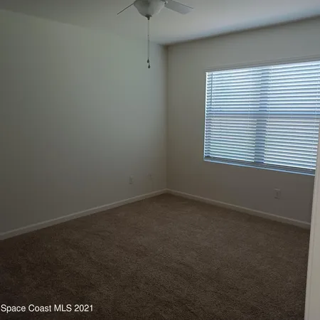 a view of a balcony dining table and chairs