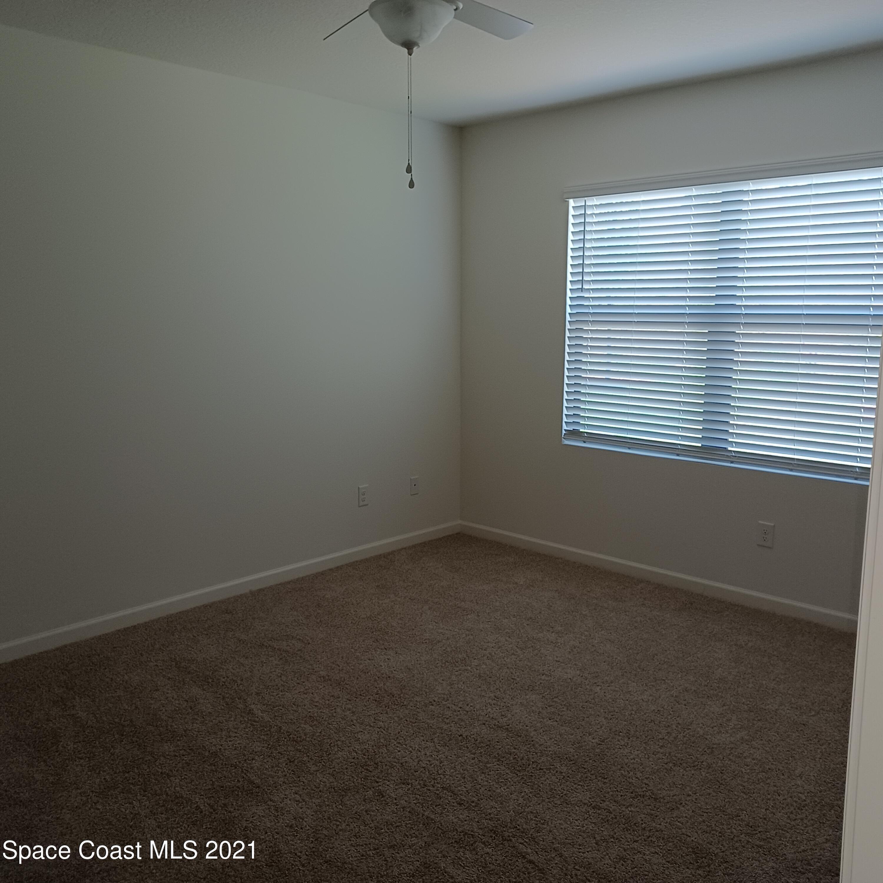 6558 Marble Road Cocoa, FL 32927 - Photo 15 of 16 an empty room with a window