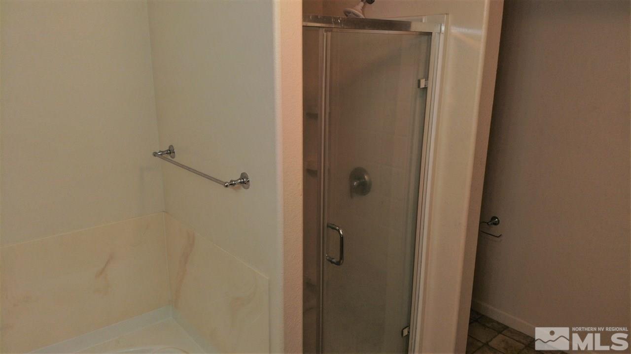 9050 Double R Boulevard, Unit 1612 Reno, NV 89521 - Photo 18 of 25 a bathroom with a shower
