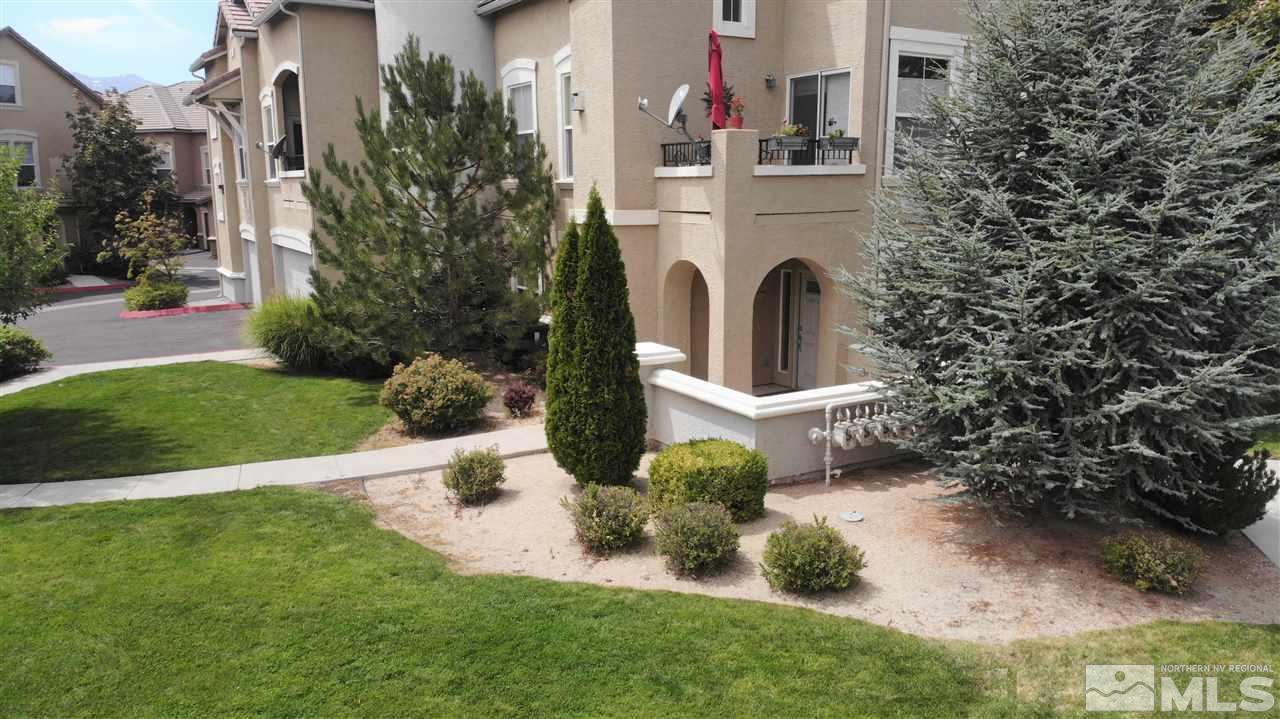 9050 Double R Boulevard, Unit 1612 Reno, NV 89521 - Photo 23 of 25 a view of a house with a yard and plants