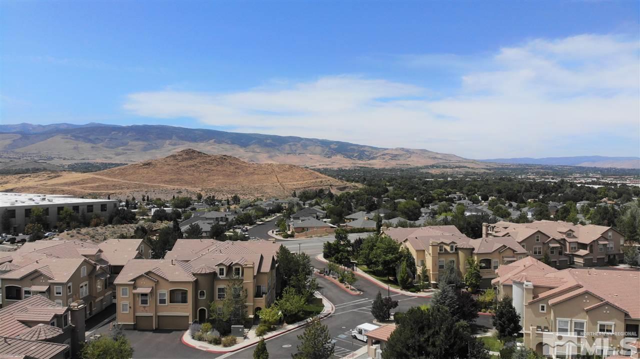 9050 Double R Boulevard, Unit 1612 Reno, NV 89521 - Photo 25 of 25 an aerial view of residential houses with outdoor space