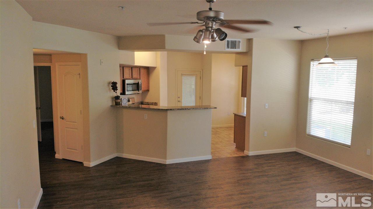 9050 Double R Boulevard, Unit 1612 Reno, NV 89521 - Photo 8 of 25 a view of a kitchen cabinets and wooden floor